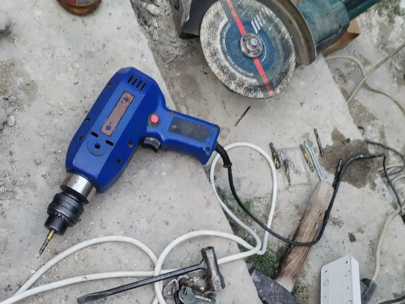 Construction tools and drill on concrete